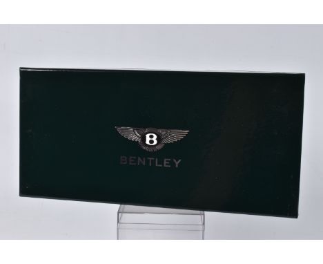 A BOXED MINICHAMPS BENTLEY ARNAGE T SCALE 1:18 MODEL VEHICLE, painted metallic black with red interior Bentley to the front a