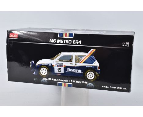 A BOXED SUNSTAR MG METRO 6R4 RAC RALLY 1986 MODEL VEHICLE SCALE 1:18, numbered 5531, painted white and blue with red and gold