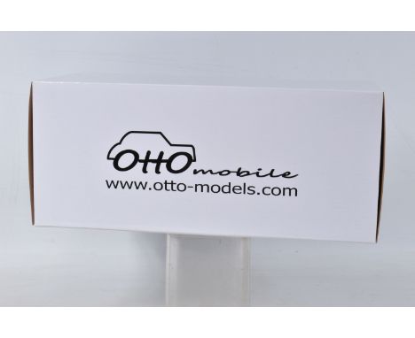 A BOXED OTTO MODELS FERRARI 308 GTB GR.4 MODEL VEHICLE SCALE 1:18, numbered OT567 UVI, painted blue and yellow with a black i