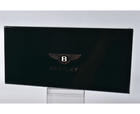 A BOXED MINICHAMPS BENTLEY CONTINENTAL FLYING SPUR SCALE 1:18, painted black with a cream interior Bentley to the front and b