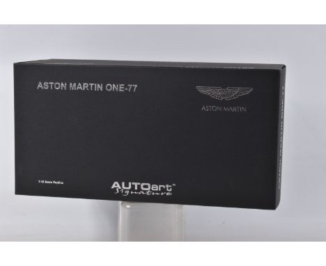 A BOXED AUTOART MODELS ASTON MARTIN ONE-77 MODEL VEHICLE SCALE 1:18, numbered 70242, painted black with a black and white int