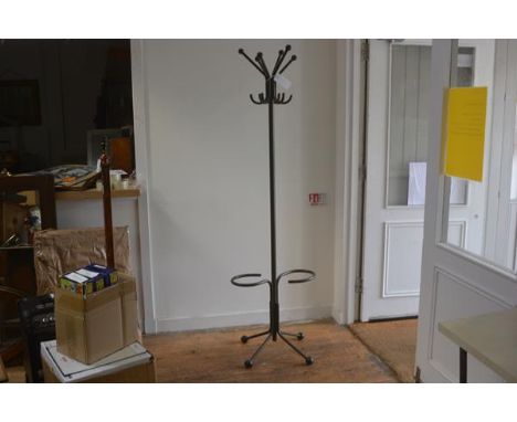 A mid century tubular steel industrial hat and coat stand with six scrolling branches to top and S shaped umbrella stand to b