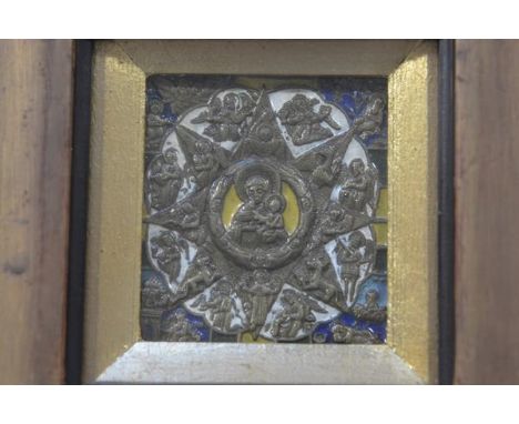 An enamelled brass icon style panel with central Madonna and Child enclosed within a radiating star of angels and saints, in 