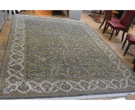 An unusual handmade Shirvan style rug, the centre panel with allover lotus leaf and flower scrolling design, enclosed within 