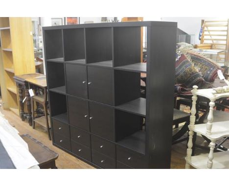 An Ikea modular black ash storage unit fitted four open sections to top with an arrangement of four panel doors and open side