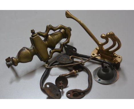 A group of brassware including a brass Regency style urn doorknocker (20cm), a pair of trunk handles, a light fitting and a b