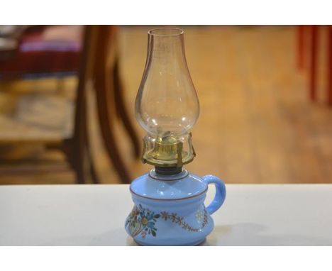 A 19thc blue glass bedchamber oil lamp with handpainted floral design, complete with glass funnel (h. 28cm)