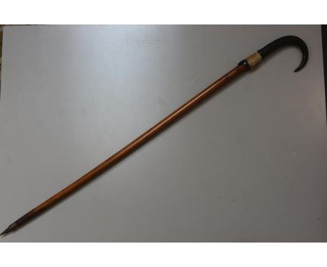 A Bavarian Grindelwald treen carved horn handled walking stick with hoof and steel tapered end (l. 90cm)