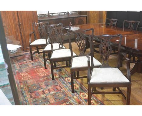 A set of six plus two Chippendale style mahogany pierced splat back dining chairs, with slip in seats, on fluted square suppo