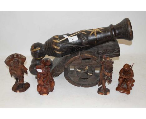 WOODEN MODEL CANNON TOGETHER WITH FOUR VARIOUS CHINESE WOODEN FIGURES (5)