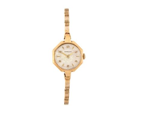 Garrard 9 carat gold ladies wristwatch, the signed white dial with Arabic and triangular numerals, manual wound, the case 21m