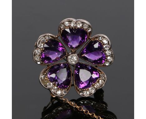 Fine amethyst and diamond set brooch, with a central diamond and an amethyst diamond capped petal surround, 26mm diameter 