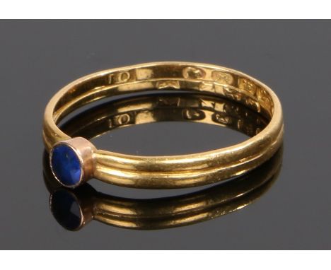 22 carat gold dual band sapphire set ring, with two 19th Century wedding bands joined with a sapphire to the head, ring size 