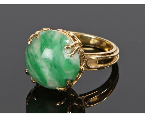 18 carat gold jade set ring, with a cabochon cut jade head, ring size M