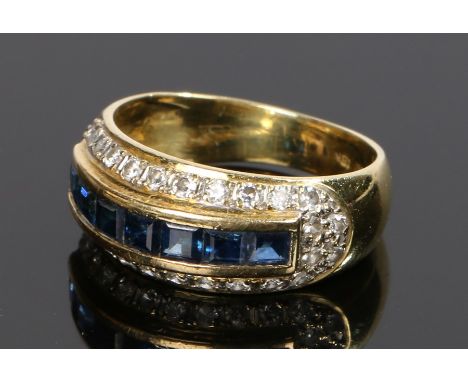 18 carat gold sapphire and diamond set ring, with a row of sapphire and diamond surround, ring size M