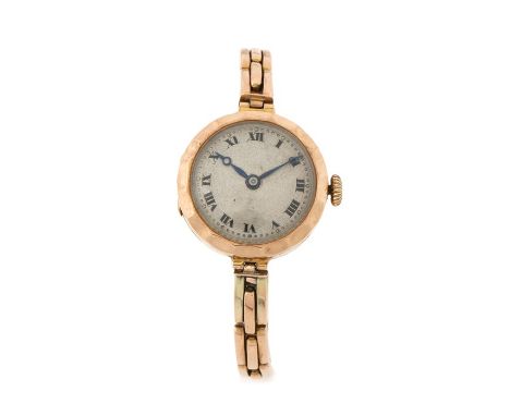 Ladies 9 carat gold wristwatch, the engine turned dial with Roman numerals, manual wound, on a sprung 9 carat gold bracelet, 