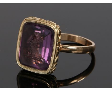 19th Century seal ring, the seal with an intaglio in a purple stone attached to an associated shank, ring size Q