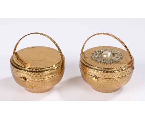 Two 1950s engine turned gold tone Kigu 'Bouquet' flower basket compacts with hinged carrying handles, one with a blank cartou