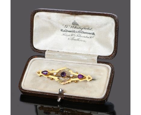 9 carat gold amethyst and pearl brooch with a round cut and two pear cut amethyst divided by two pearls to the leaf decorated