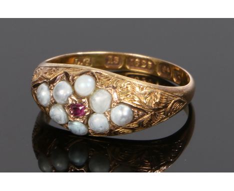 15 carat gold ruby and pearl set ring, with a central ruby and pearl surround, ring size M