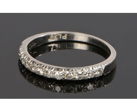 Platinum and diamond set half eternity ring, with a row of twelve diamonds to the shank, ring size O