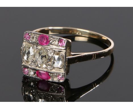 19th Century diamond and ruby set ring, with eleven diamonds to the head and six rubies, a later 14 carat gold shank, ring si