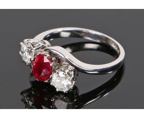 18 carat white gold and diamond set ring, the central ruby at 1.12 carat and a total estimated diamond weight of 0.80 carat, 