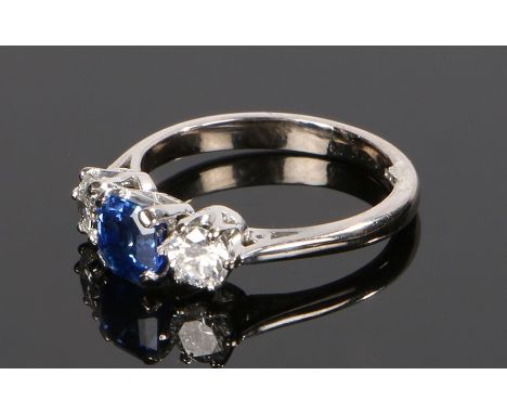 18 carat white gold sapphire and diamond set ring, the central sapphire at 1.19 carat flanked by a diamond to either side, ri