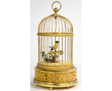 A SWISS CLOCKWORK SINGING BIRD IN A CAGE AUTOMATON, 27CM H EXCLUDING RING, MARKED REUGE MUSIC SAINTE-CROIX MADE IN SWITZERLAN