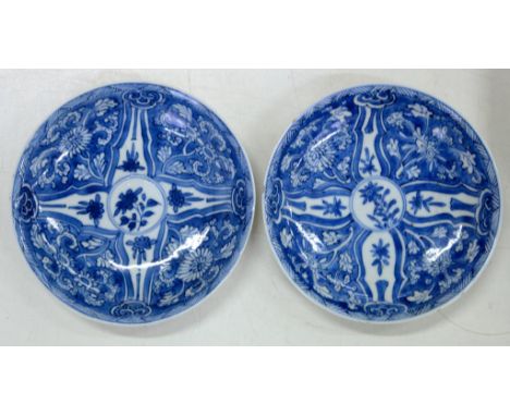 A PAIR OF CHINESE BLUE AND WHITE SAUCERS, PAINTED WITH A QUARTERED DESIGN OF FOLIAGE IN DIAPER BORDER, 12.5CM D, PAINTED SYMB