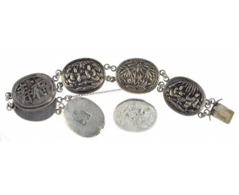 A CHINESE SILVER BRACELET, OF SIX OVAL REPOUSSÉ PANELS OF SCENES, FOLIAGE OR CALLIGRAPHY, 34.5G AND A SIMILAR BROOCH