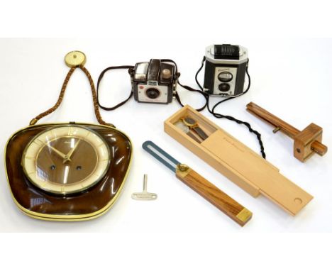 A KODAK BAKELITE HOLIDAY BROWNIE CAMERA, A TWIN LENS REFLEX CAMERA, A MID CENTURY WALL CLOCK, A BRASS AND HARDWOOD MARKING GA