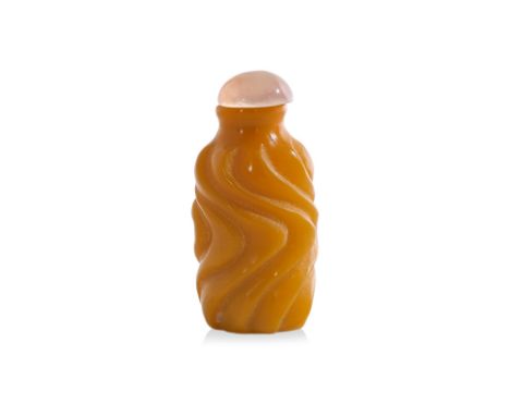 A YELLOW OPAQUE GLASS SNUFF BOTTLE
19th/20th Century, the cylindrical body carved with a conitnuous vertical wave pattern
5.5