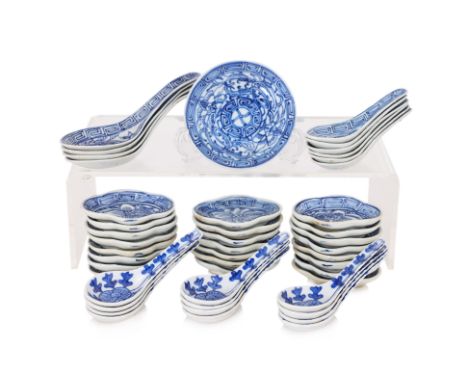 A GROUP OF BLUE AND WHITE PORCELAIN SAUCE DISHES AND SPOONS
Comprising: 23 shaped oval sauce dishes, with sweet peas and key 