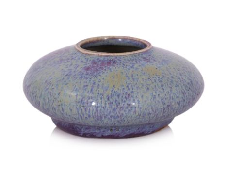 A FLAMBE GLAZED PORCELAIN WASHER OR WATER POT
Qing, 19th Century, of squat circular form, covered in a thick purple and blue 