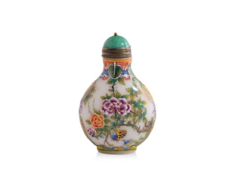 AN ENAMELLED OPAQUE GLASS SNUFF BOTTLE
Ovoid form opaque white glass bottle, decorated in enamelled peonies and butterflies, 