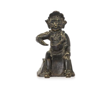 A SMALL BRONZE FIGURE OF ZHOU CANG Modelled wearing robe over armour, right hand raised and palm facing upward, on tiered sea