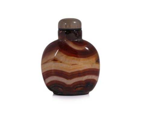 A BANDED AGATE SNUFF BOTTLE
Compressed oviform bottle in grey-blue and brown tones, polished and undecorated to both sides sh
