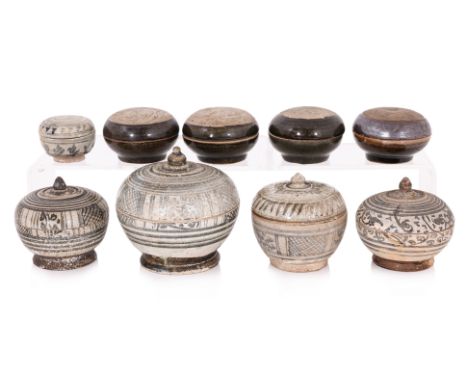 A GROUP OF NINE CHINESE AND THAI POTTERY CIRCULAR BOXES AND COVERS
Yuan/Ming dynasty, and Thai Sawankhalok circa 15th century