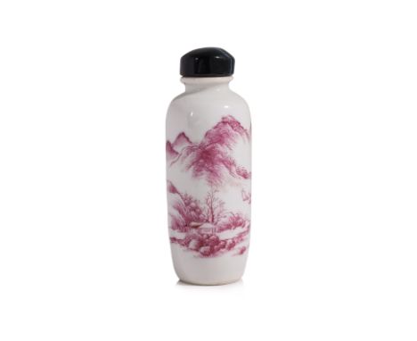 A PUCE-ENAMELLED PORCELAIN SNUFF BOTTLE
Cylindrical form with short waisted neck, decorated in landscape of mountains and lak