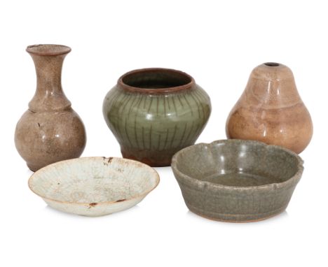 A GROUP OF SMALL CELADON AND QINGBAI CERAMICS
Comprising: a shaped circular brush washer, with pale green crackled glaze; a s