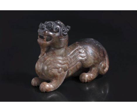 A JADE CARVING OF PIXIU
Dark celadon and russet toned jade, modelled standing with head tilted back and mouth open, relief ca