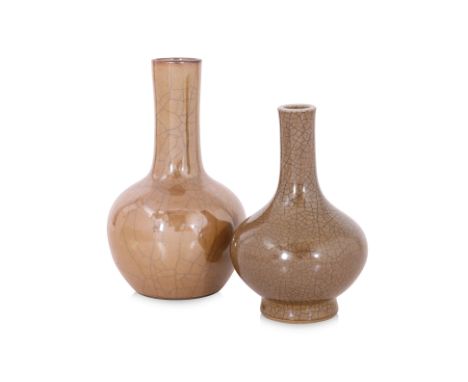 TWO SMALL BROWN CRACKLE GLAZED BOTTLE VASES
19th/20th Century, the smaller with a fine dark crackle the glaze, the larger exa