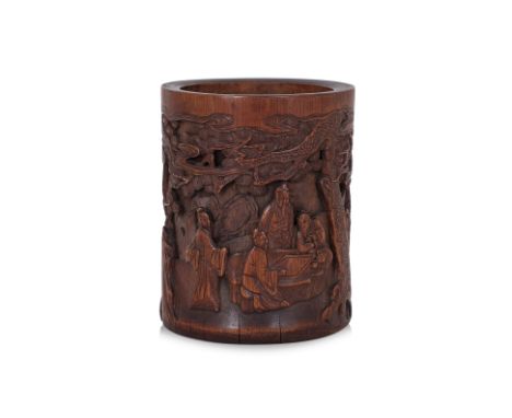 A CARVED BAMBOO BRUSH POT
Decorated in continuous scene of men playing board game under pine trees and rocky outcrops
15.5cm 