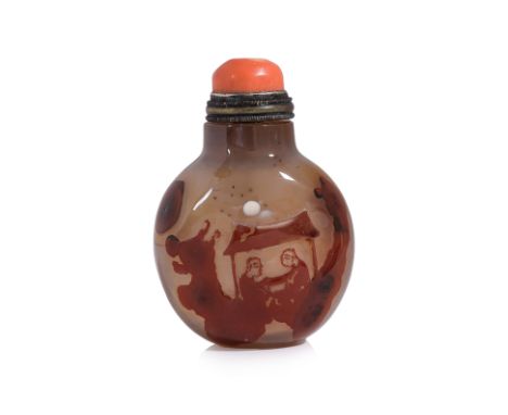 A CARVED CHALCEDONY SNUFF BOTTLE
Well hollowed circular bottle in grey tones with reddish-brown outer section, decorated in t