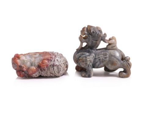 TWO CARVED JADE MYTHICAL BEASTS
Hetian jade in celadon-grey and russet, recumbent mythical beast modelled with mouth open and
