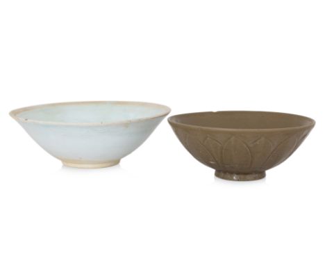A QINGBAI BOWL AND A YAOZHOU CELADON GREEN LOTUS BOWL
Southern Song, a qingbai pale-blue glazed bowl with carved motif, and a