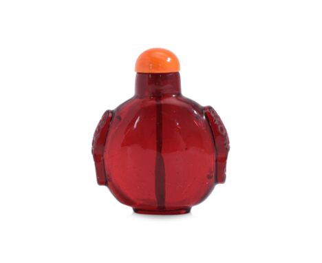 A RUBY-RED GLASS SNUFF BOTTLE
18th/19th Century, compressed circular form, transparent ruby-red glass with fine bubble inclus