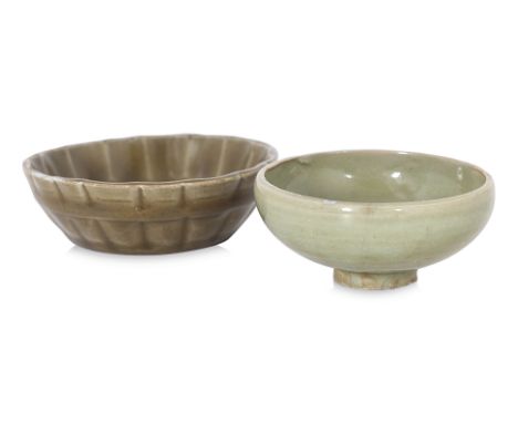 TWO SMALL CELADON BOWLS
Ming dynasty, a small green glazed bowl with rounded sides and moulded floret to well, and a small ol