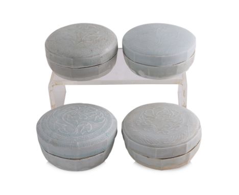 A GROUP OF FOUR QINGBAI COSMETICS BOXES AND COVERS
Song dynasty, four circular boxes with covers piping decorated in peony, t